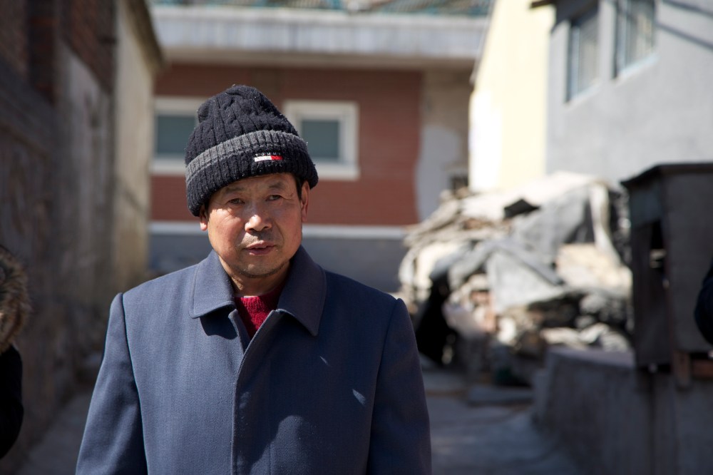 village man in hilfiger hat